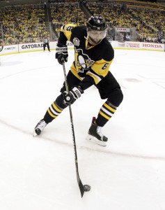 Apr 12, 2017; Pittsburgh, PA, USA;  Pittsburgh Penguins defenseman Brian Dumoulin (8) gathers the puck against the Columbus Blue Jackets during the first period in game one of the first round of the 2017 Stanley Cup Playoffs at PPG PAINTS Arena. The Penguins won 3-1. Mandatory Credit: Charles LeClaire-USA TODAY Sports